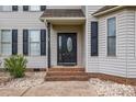 Close-up of the elegant front door, featuring sidelights and brick steps at 500 Pearl Place Ln, York, SC 29745