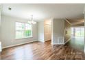 Bright and airy living room with hardwood floors and large windows at 5832 Amity Springs Dr, Charlotte, NC 28212