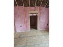 Unfinished interior room with pink insulation at 1506 7Th St, Statesville, NC 28677