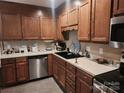 Kitchen featuring wood cabinets, stainless steel appliances, and a black sink at 2015 Pine Needle Ct, Gastonia, NC 28056