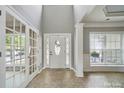 Inviting foyer with high ceilings, decorative door, and ample natural light welcomes guests at 3007 Gambrill Falls Dr, Indian Trail, NC 28079