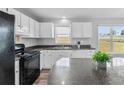 Well-lit kitchen featuring a large island, modern appliances, and ample counter space at 301 Walkers Ridge Dr, Shelby, NC 28152