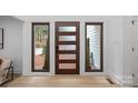 Modern entryway with wood door and sidelights at 3216 High Ridge Rd, Charlotte, NC 28270