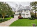 Charming home with well-manicured lawn, mature trees and inviting curb appeal at 501 River Oaks Ln, Charlotte, NC 28226