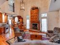 This living room features hardwood floors, a large fireplace, and a well-lit atmosphere at 501 River Oaks Ln, Charlotte, NC 28226