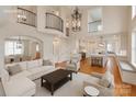 Bright, open living space with soaring ceilings and views to the modern kitchen at 501 River Oaks Ln, Charlotte, NC 28226
