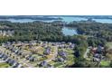 Stunning aerial view showcasing the community's prime location near the serene lake and lush greenery at 3157 Delaware Dr, Denver, NC 28037