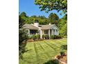 Beautifully landscaped front yard featuring a single-story home with mature trees, and manicured lawn at 796 Cornelius Rd, Mooresville, NC 28117