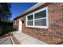 Close-up showcasing the brick detail and the entrance with a black railing at 125 S Ervin Ave, Newton, NC 28658