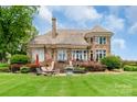 Beautiful home with a spacious backyard, patio area, lush lawn, and scenic view at 18212 Pompano Pl, Cornelius, NC 28031