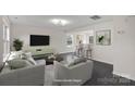 Virtually staged living room featuring modern furniture and a stylish bar at 2807 Station Sw Ln, Concord, NC 28025