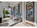 Relaxing front porch with a swing and rocking chairs at 376 Delburg St, Davidson, NC 28036