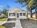 Newly constructed white house with a covered porch at 305 Gooch St, Lancaster, SC 29720