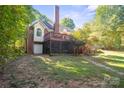 Spacious backyard with a large deck and patio at 128 Archbell Point Ln, Mooresville, NC 28117
