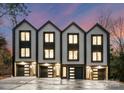 Modern three-unit townhome development with attached garages at 156 Mattoon St, Charlotte, NC 28216