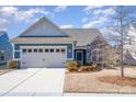 Two-car garage and nicely landscaped front yard at 255 Olive St, Fort Mill, SC 29715