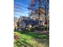 Stately home with mature landscaping, large windows, and attached two car garage at 377 Riverwood Rd, Mooresville, NC 28117