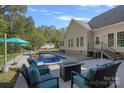 Inviting in-ground pool with deck and seating area at 357 China Grove Rd, Kannapolis, NC 28083