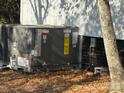 Exterior shot of a new HVAC (heating, ventilation, and air conditioning) unit sitting on a bed of autumn leaves at 7608 Kershaw Camden Hwy, Kershaw, SC 29067