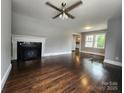 Inviting living room boasts a decorative fireplace and gleaming hardwood floors at 3337 Eastway Dr, Charlotte, NC 28205