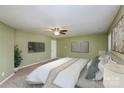 Serene bedroom boasting modern decor, soft carpeting, and a ceiling fan for added comfort at 135 Anastasia Ln, Lincolnton, NC 28092