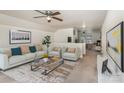 Bright living room featuring a neutral color palette, modern furnishings, and an open floor plan at 135 Anastasia Ln, Lincolnton, NC 28092