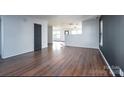 Spacious living area boasting luxury vinyl flooring, plenty of natural light, and modern finishes at 310 Foster Ln, Albemarle, NC 28001