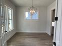 Bright dining room featuring hardwood floors and a modern light fixture at 714 Barrel Aly, Fort Mill, SC 29715