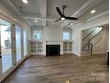 Spacious living room with built-in shelving, fireplace, and hardwood floors at 714 Barrel Aly, Fort Mill, SC 29715