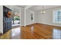 Bright dining room with hardwood floors and a view of the front yard at 1360 Barnett Woods, Fort Mill, SC 29708