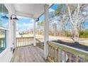 View from the porch of a new construction home with wooden decking and white railings at 150 Roxie Ln, Belmont, NC 28012