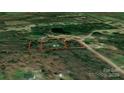 An overhead view shows the property surrounded by lush trees and greenery at 1216 Stallion Ln, Lancaster, SC 29720