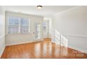 Bright dining room with hardwood floors and crown molding at 127 High Ridge Rd, Mooresville, NC 28117