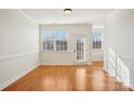 Bright dining room with hardwood floors and crown molding at 127 High Ridge Rd, Mooresville, NC 28117