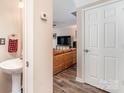 Hallway view leading into the living room with a half bath on the left at 4707 Hannah Dr, Rock Hill, SC 29732