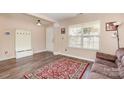 Cozy living room featuring a large window, wood floors, and a warm color scheme at 4707 Hannah Dr, Rock Hill, SC 29732