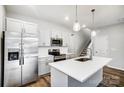 Modern kitchen with white cabinets, stainless steel appliances, and an island at 112 Bickett Ave, Gastonia, NC 28052