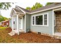 Charming craftsman style home with gray siding and stone accents at 2186 W Nc 10 Hwy, Newton, NC 28658