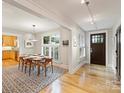 Bright dining room with hardwood floors and a view of the kitchen at 2526 Normandy Rd, Charlotte, NC 28209