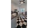Well-lit kitchen with modern appliances and a black-and-white checkered floor at 4000 Wilson Ln, Charlotte, NC 28206