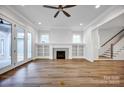 Bright living room with fireplace, built-in shelves, and French doors at 613 Hops Aly, Fort Mill, SC 29715