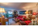 Cozy living room featuring a piano, comfy sofa, and ample natural light at 3722 Park Rd # Q, Charlotte, NC 28209
