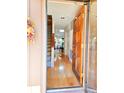 Home entryway featuring hardwood floors, staircase and an open view into the living room at 1652 12Th Ne St, Hickory, NC 28601