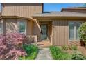 Inviting front entrance with a well-maintained small porch, featuring natural light and fresh landscaping at 1652 12Th Ne St, Hickory, NC 28601