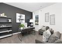 Well-lit home office featuring a modern desk, comfortable seating, and stylish decor with natural light at 3865 Maxwell Henry Nw Ln, Conover, NC 28613