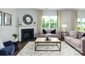 Cozy living room featuring a fireplace, plush seating, and a large window at 3880 Maxwell Henry Nw Ln, Conover, NC 28613