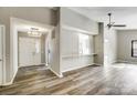 Inviting living space offering views of the entry and kitchen area with hardwood floors at 11429 Spreading Oak Ln, Charlotte, NC 28226