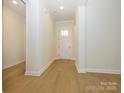Bright entryway with light hardwood floors leading to the home's interior at 1200 Meander Ln, Waxhaw, NC 28173