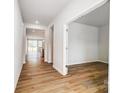 Bright hallway with wood floors leading to various rooms at 2608 Tillman St, Monroe, NC 28112