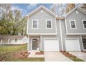 Charming two-story townhome with a one-car garage and freshly landscaped front yard at 9247 Eleanor Dr, Charlotte, NC 28214